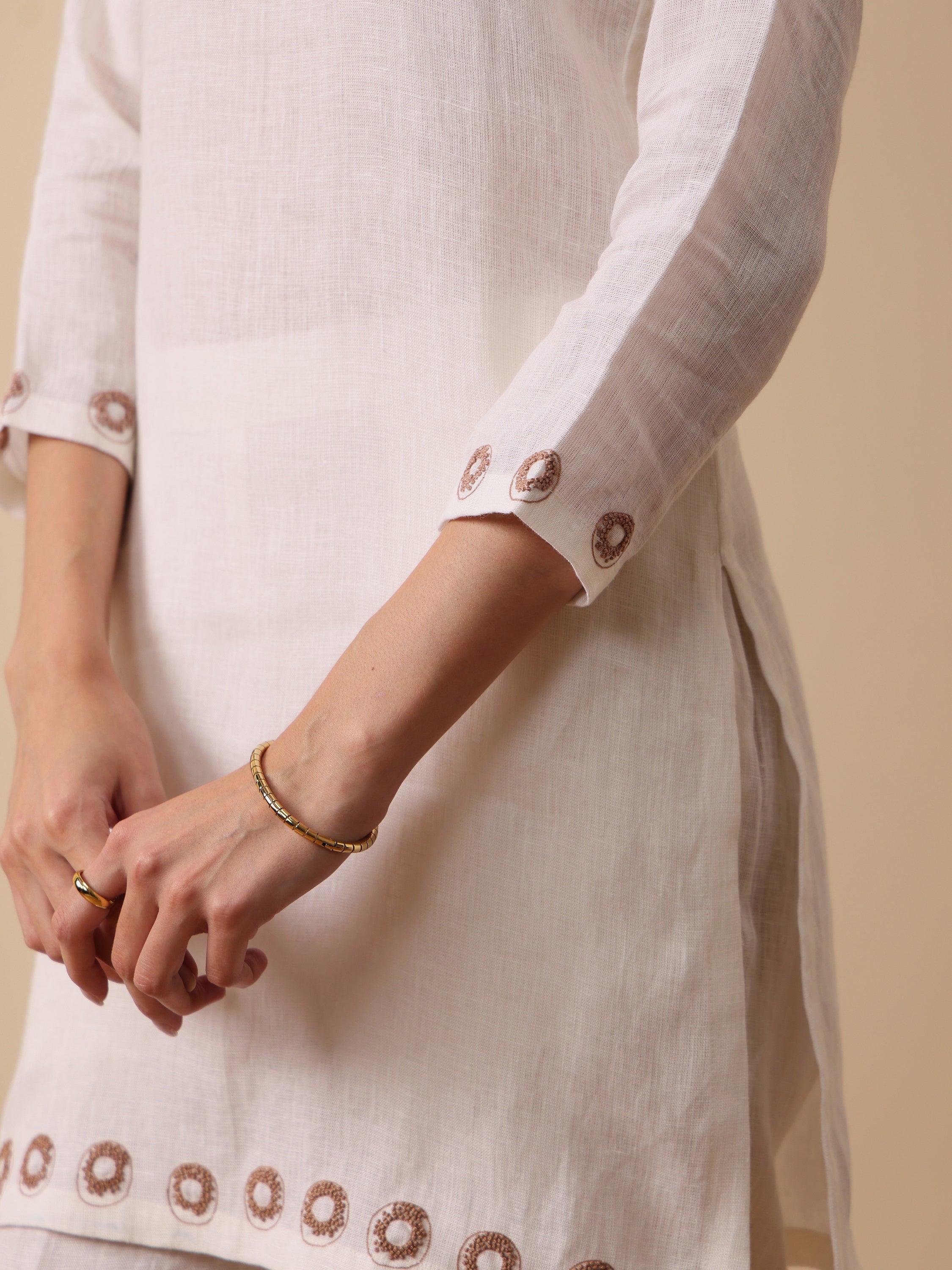 Off white lenin embroidered boat neck kurta with pant